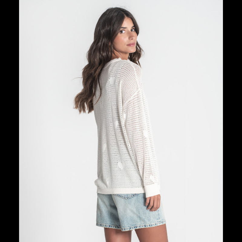 Camisola de decote redondo, perfurada com corações, em crú.
Composição: 67%Liocel + 33%Algodão